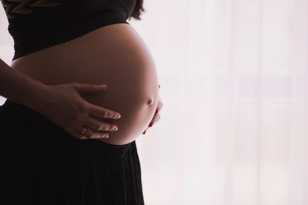 pregnant woman showing belly